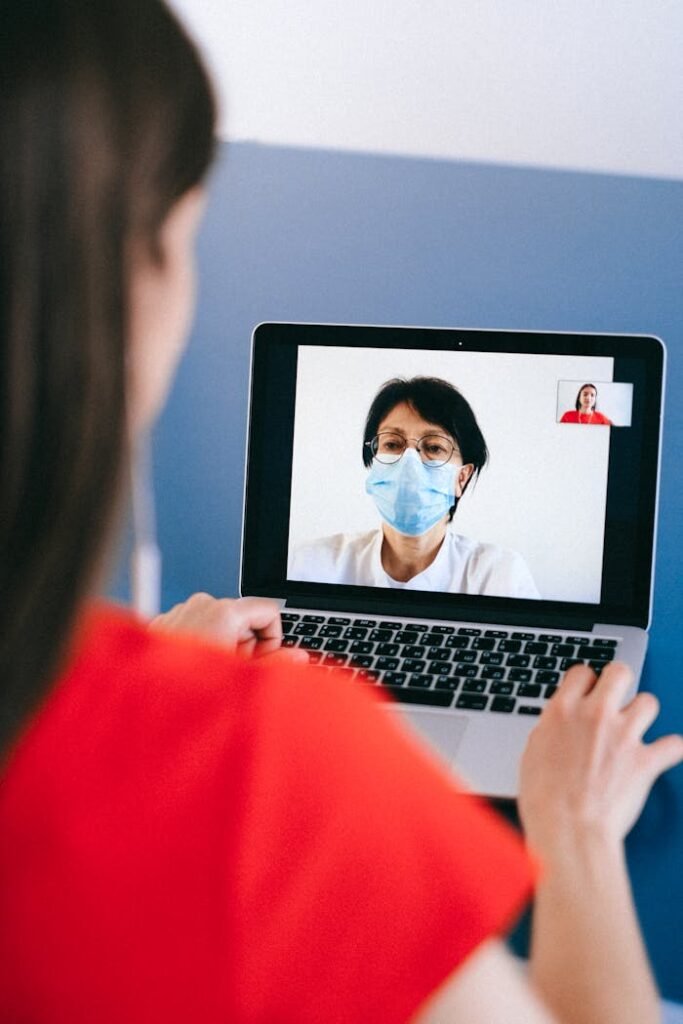 pexels photo 4225881 A telemedicine session with a doctor on a laptop screen, highlighting health consultation during COVID-19.